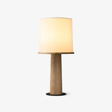 Cylinder table lamp with a fabric drum on a light wood column