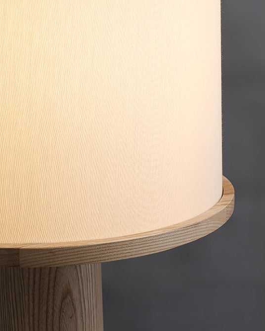 Close view of the fabric drum meeting the wood column top