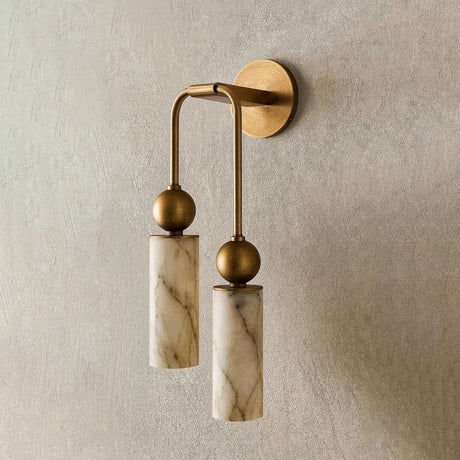 Two cylinders at different heights on a plaster wall above a bench