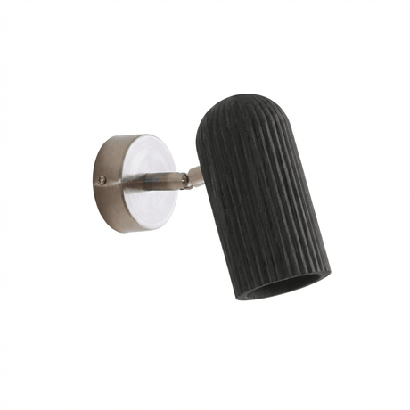 Fluted black cylinder angled out from its brushed nickel wall plate