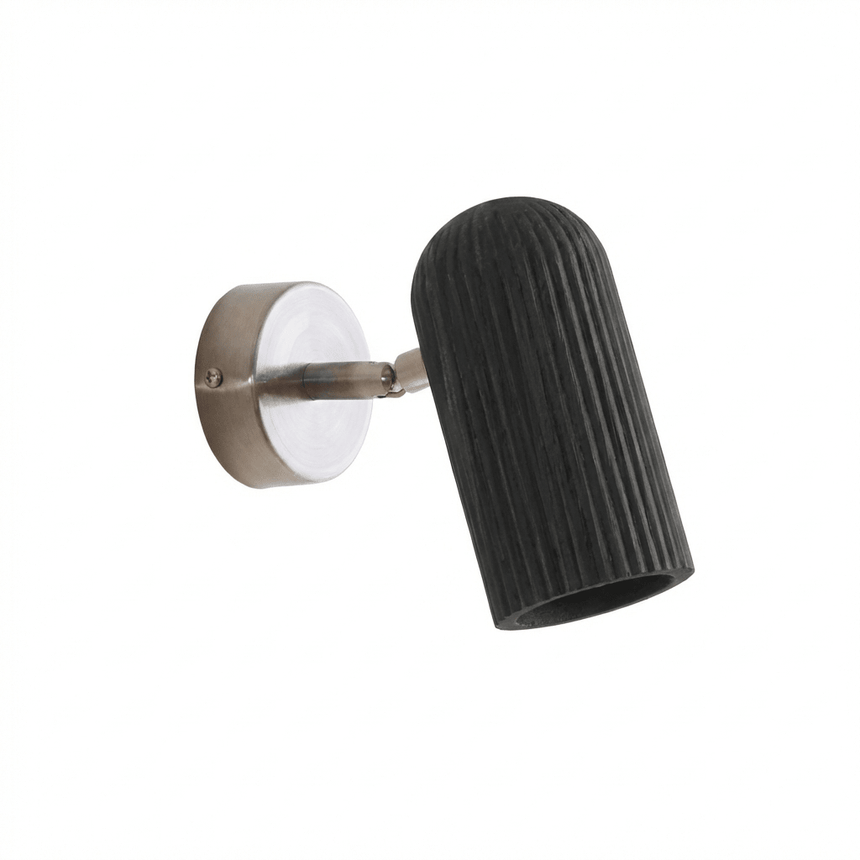 Fluted black cylinder angled out from its brushed nickel wall plate