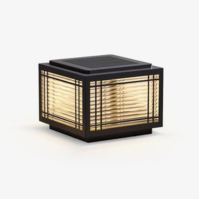 Square post cap with a ribbed glass lantern behind a slim black grid