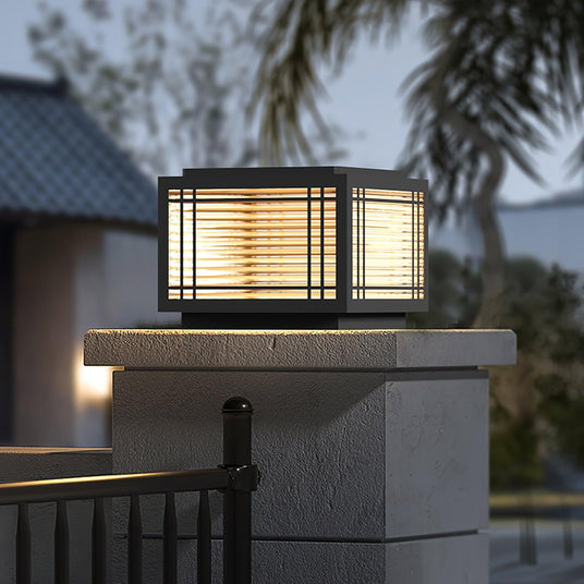 The cap lit on a rendered pillar with a palm and a dark sky behind