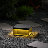 The box seen level, the lit gap running around it between body and base