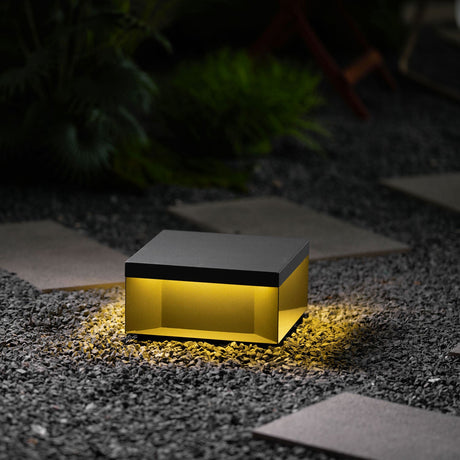The box seen level, the lit gap running around it between body and base