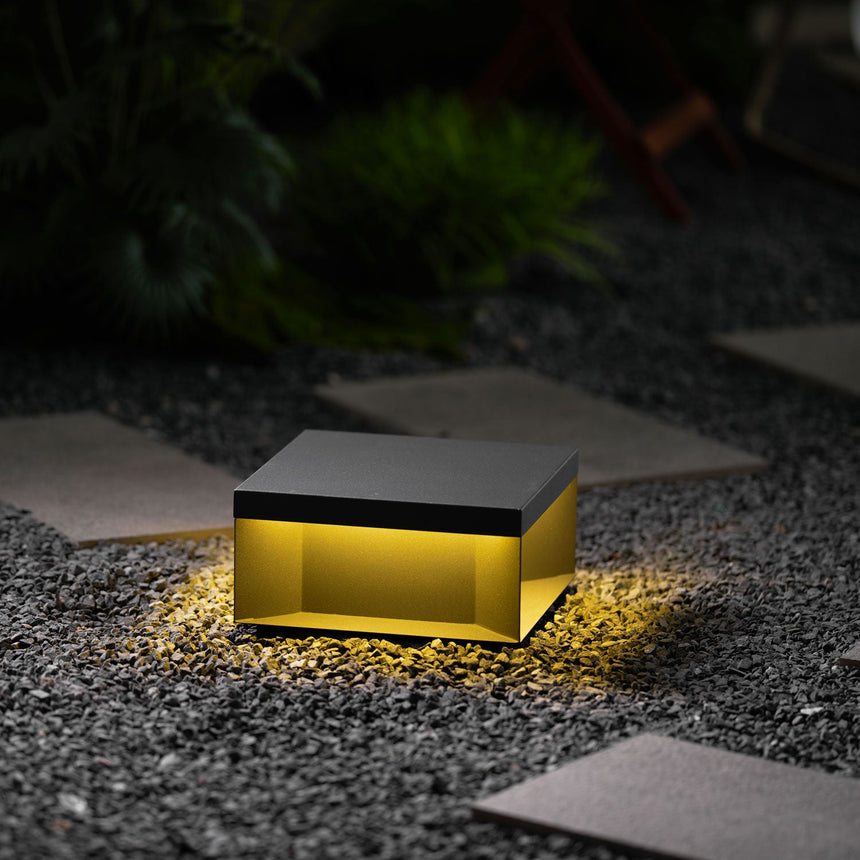 The box seen level, the lit gap running around it between body and base