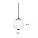 The transparent sphere drawn with its 30 cm width marked