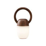 Dimmable bedside lamp in walnut, lit and seen from the front