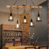 Chandelier lit in a room with a brick wall and a wood crate wall behind