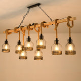 The beam chandelier lit warm with all eight filament lamps burning