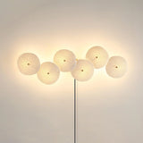 Six discs in a horizontal row, lit, the cord dropping from the center