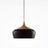 Black dome with its wood collar on a plain background