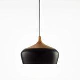 Black dome with its wood collar on a plain background