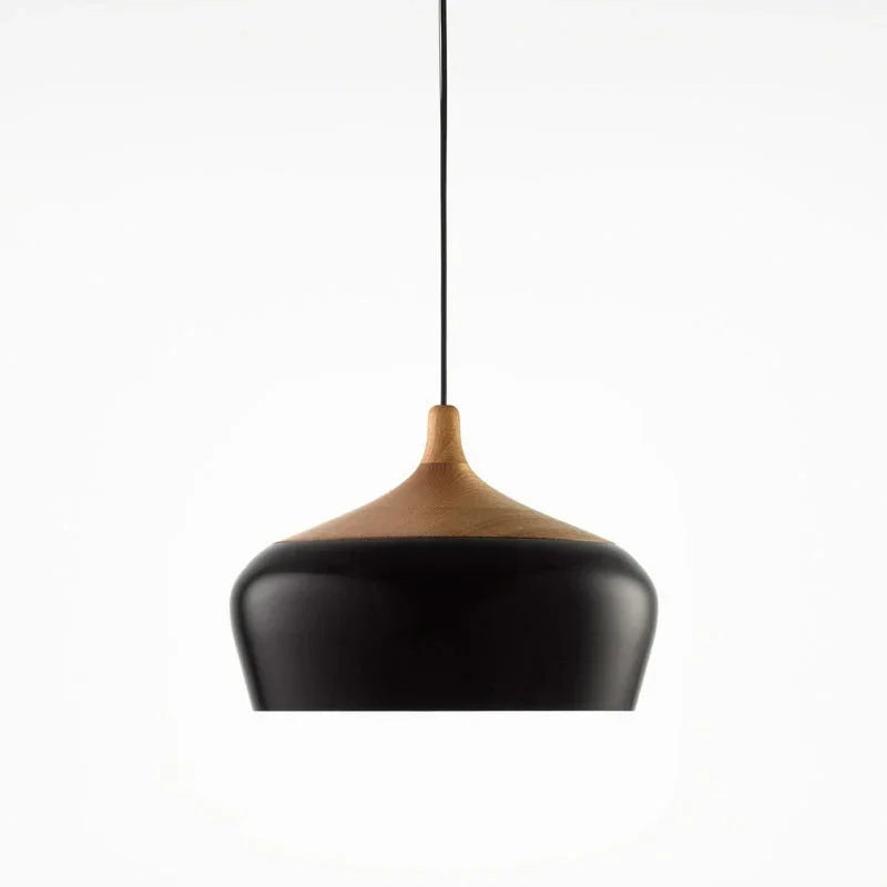 Black dome with its wood collar on a plain background
