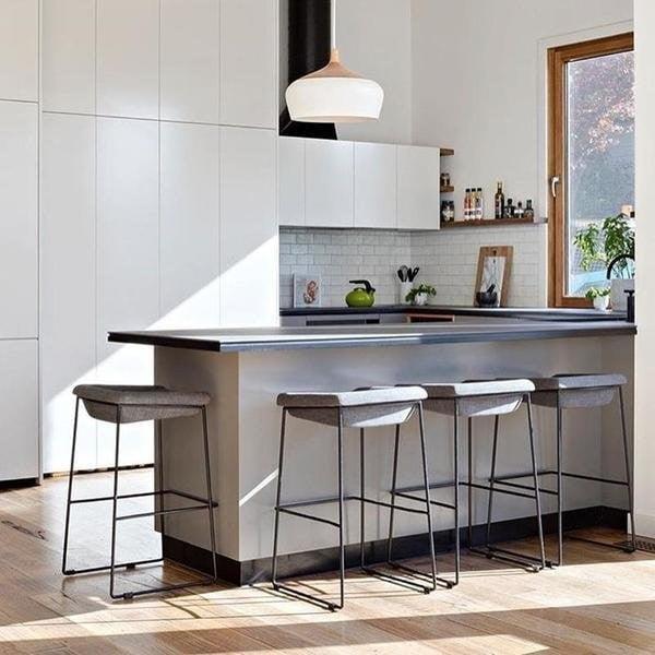 Two domes above a dark kitchen island