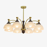 The fitting seen in full with its stem, brass arms and glass domes