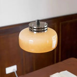 The amber dome lit in a corner showing the chrome collar above the glass