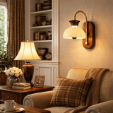 Traditional wall sconce with a metal shade