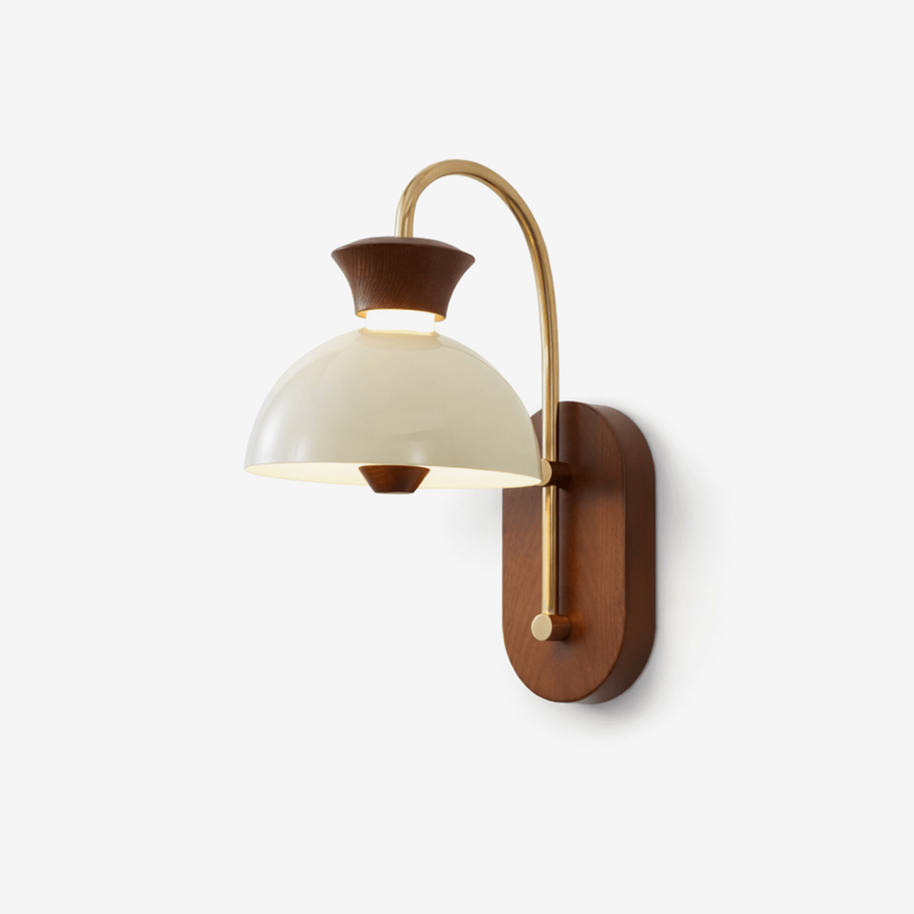 Dome wall sconce, a white glass dome under a gold arc off a walnut plate