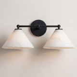 The black version with two stone cone shades, seen on a pale wall