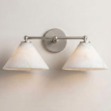 The nickel version with two stone cone shades, seen on a pale wall