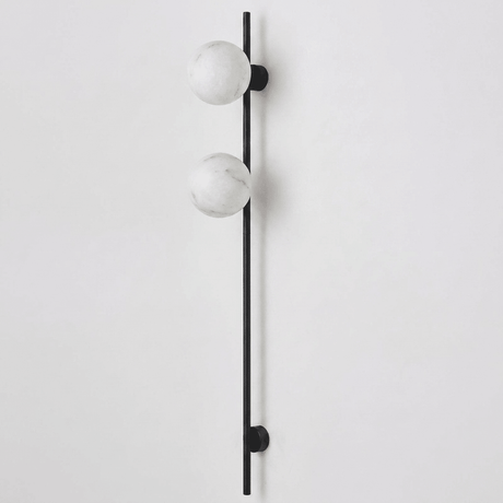 The black version with two stone globes on a white background