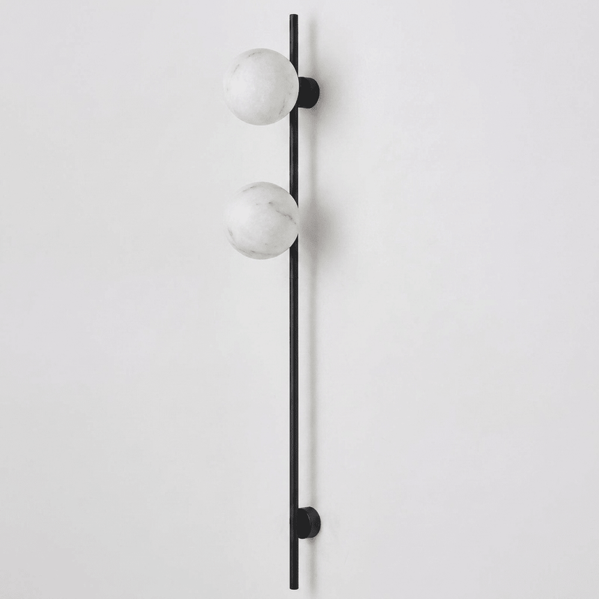 The black version with two stone globes on a white background