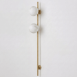 The brass version with two stone globes on a white background