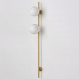 The brass version with two stone globes on a white background