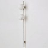 The nickel version with two stone globes on a white background