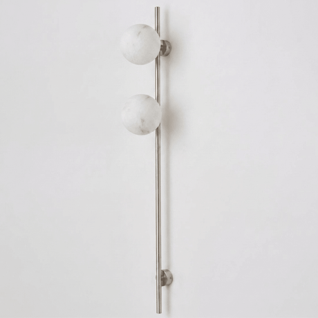 The nickel version with two stone globes on a white background
