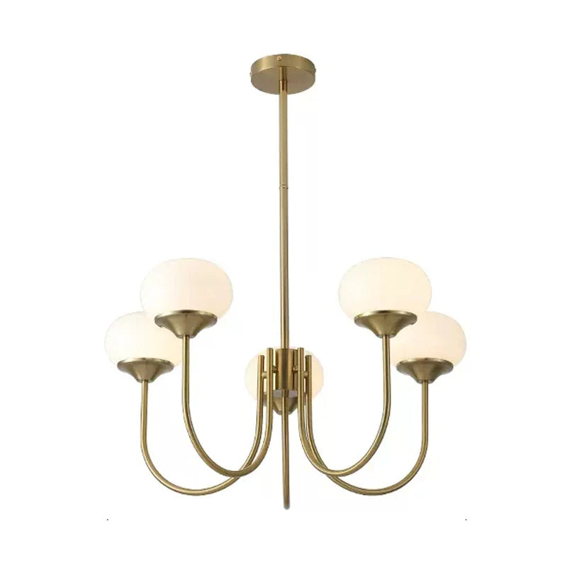brass chandelier installed in bedroom setting