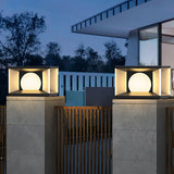 A row of lit cubes along pillars above a dark slatted boundary fence