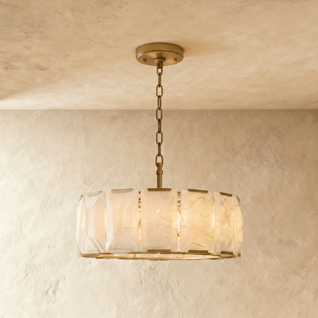 A taller alabaster drum in a brass frame below a ceiling plate