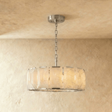 A taller alabaster drum in a silver frame on a slim chain