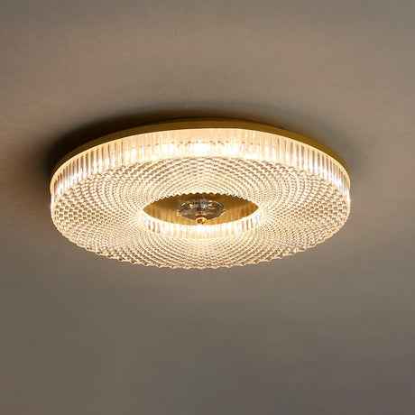 Ribbed drum ceiling light lit and seen from below at an angle
