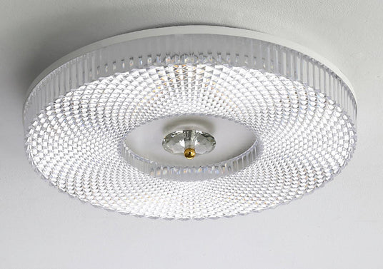 Ribbed drum ceiling light seen straight from below, unlit