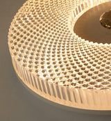 Close view of the brass center plate and the ribbed edge