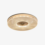 Ribbed drum ceiling light with a dark rim on a pale backdrop