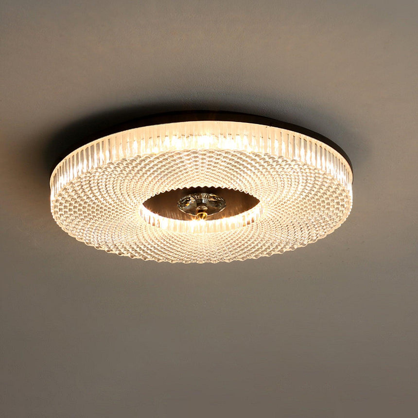 Ribbed drum ceiling light lit against a gray ceiling