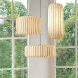 Ribbed silk shades hung in a hallway with tall windows