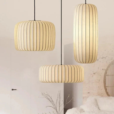 Two ribbed silk drums lit above a seating area