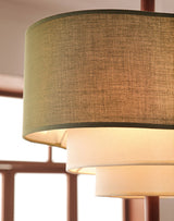 Side view showing the wood spine running through the three drums