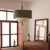 Tiered drum shade hung beside a window with a dark wood cabinet below