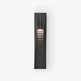 Narrow black solar wall light with a louvered front and a warm light at the top