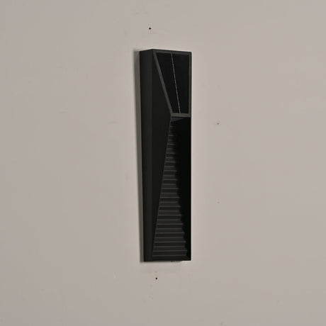 The medium size unlit on a beige wall, the tapered louvered front clear
