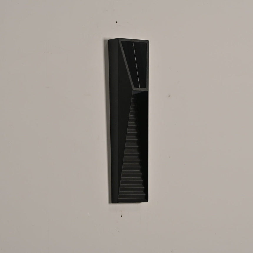 The medium size unlit on a beige wall, the tapered louvered front clear