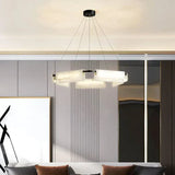 Chandelier casting warm glow through alabaster stones