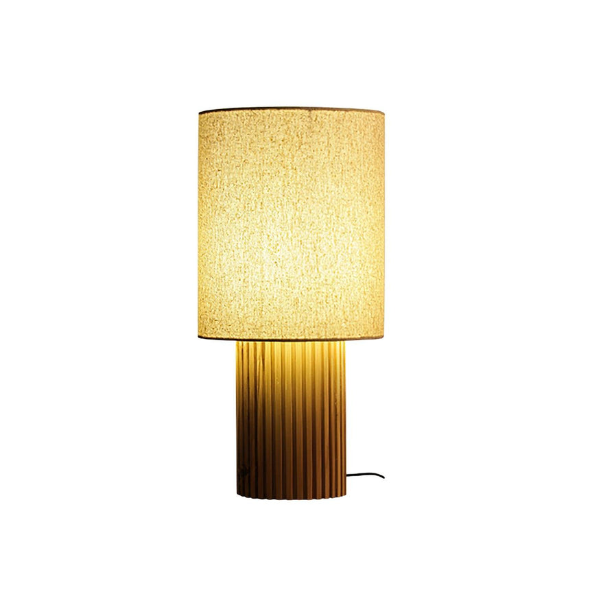 Entryway table lamp in natural wood seen from the front, plain background