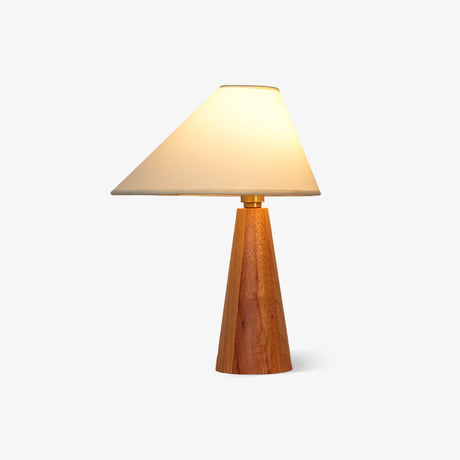 Wood cone lamp lit warm on a plain ground, the shade glowing